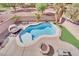 Inviting backyard pool with fire pit and patio at 6145 Sydney Bay Ct, North Las Vegas, NV 89081