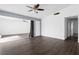 Open living room with hardwood floors and access to other rooms at 6223 Foothill Blvd, Las Vegas, NV 89118