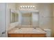 Well-lit bathroom with double vanity and tile flooring at 6255 W Arby Ave # 258, Las Vegas, NV 89118