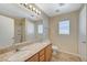 Bathroom with double vanity and a large mirror at 6255 W Arby Ave # 258, Las Vegas, NV 89118