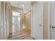 Long hallway with light wood flooring and closet at 6255 W Arby Ave # 258, Las Vegas, NV 89118