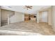 Open living room with kitchen, tile floors, and stairs at 6255 W Arby Ave # 258, Las Vegas, NV 89118