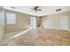 Bright living room with tile floors and a ceiling fan at 6255 W Arby Ave # 258, Las Vegas, NV 89118