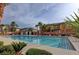 Community pool with surrounding landscaping at 6255 W Arby Ave # 258, Las Vegas, NV 89118