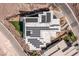 Aerial view of modern luxury home with solar panels and unique design at 631 Cityview Ridge Dr, Henderson, NV 89012