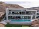 Modern home featuring an infinity pool with panoramic city views at 631 Cityview Ridge Dr, Henderson, NV 89012