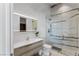 Modern bathroom features a floating vanity and a glass enclosed shower with white and gray marble tile surround at 631 Cityview Ridge Dr, Henderson, NV 89012