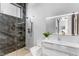 Modern bathroom features a glass enclosed shower, floating vanity, and decorative tile surround and backsplash at 631 Cityview Ridge Dr, Henderson, NV 89012