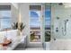 A close-up of the primary bathroom with a glass shower, vanity, and gorgeous views at 631 Cityview Ridge Dr, Henderson, NV 89012