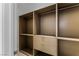 Walk-in closet with built-in shelving and drawers to maximize storage capacity with neutral finish at 631 Cityview Ridge Dr, Henderson, NV 89012