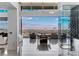 Elegant dining space with a scenic city view, a sleek wine rack, and a glass wall enhancing the bright atmosphere at 631 Cityview Ridge Dr, Henderson, NV 89012