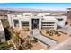 Contemporary home with a meticulously landscaped front yard and a modern driveway entrance at 631 Cityview Ridge Dr, Henderson, NV 89012