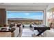 Open living room with sliding glass doors offering expansive city views at 631 Cityview Ridge Dr, Henderson, NV 89012