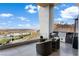 Outdoor kitchen and seating area with built-in grill, offering stunning city and mountain views at 631 Cityview Ridge Dr, Henderson, NV 89012