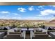 Stylish outdoor seating area with comfortable couches offering stunning panoramic city views at 631 Cityview Ridge Dr, Henderson, NV 89012