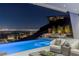 Stunning pool and patio area with city views, perfect for outdoor entertaining at 631 Cityview Ridge Dr, Henderson, NV 89012