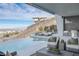 Relax in luxury with this infinity pool and outdoor kitchen at 631 Cityview Ridge Dr, Henderson, NV 89012