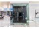 This modern home has a glass-enclosed wine cellar with sleek metal racks, creating a stylish storage and display space at 631 Cityview Ridge Dr, Henderson, NV 89012