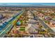 Aerial view of a house, neighborhood, and distant city skyline at 6971 Cedar Basin Ave, Las Vegas, NV 89142