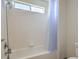 Simple bathroom with shower/tub combo and light blue curtain at 6971 Cedar Basin Ave, Las Vegas, NV 89142