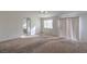 Bright bedroom featuring a view into the bathroom and carpet flooring at 6971 Cedar Basin Ave, Las Vegas, NV 89142