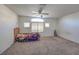 Spacious bedroom with carpeted floors and a ceiling fan at 6971 Cedar Basin Ave, Las Vegas, NV 89142