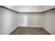 Walk-in closet with wood shelving and neutral carpeting at 6971 Cedar Basin Ave, Las Vegas, NV 89142