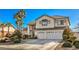 Two-story house with a three-car garage and manicured landscaping at 6971 Cedar Basin Ave, Las Vegas, NV 89142