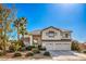 Two-story house with a three-car garage and landscaped yard at 6971 Cedar Basin Ave, Las Vegas, NV 89142