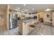 Well-equipped kitchen featuring granite countertops and breakfast bar at 6971 Cedar Basin Ave, Las Vegas, NV 89142