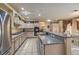 Spacious kitchen with an island, granite countertops, and stainless steel appliances at 6971 Cedar Basin Ave, Las Vegas, NV 89142