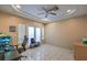 Home office with tile flooring, ceiling fan and French doors at 6971 Cedar Basin Ave, Las Vegas, NV 89142