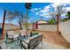 Backyard with a patio seating area and concrete block perimeter wall at 705 Thousand Oaks Dr, Las Vegas, NV 89123