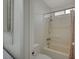 Bathroom featuring a shower-tub combo with tiled walls at 705 Thousand Oaks Dr, Las Vegas, NV 89123