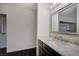 Bathroom with a sleek vanity and a door leading to a walk-in closet at 705 Thousand Oaks Dr, Las Vegas, NV 89123