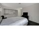 Bedroom featuring dark hardwood floors, closet storage, and a television at 705 Thousand Oaks Dr, Las Vegas, NV 89123