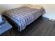 Bedroom with full-size bed and dark grey blanket at 705 Thousand Oaks Dr, Las Vegas, NV 89123