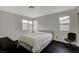 Bedroom with modern gray bed frame and dark hardwood floors at 705 Thousand Oaks Dr, Las Vegas, NV 89123