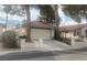 House exterior with a driveway and neatly maintained landscaping at 705 Thousand Oaks Dr, Las Vegas, NV 89123