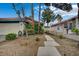 Charming single-story home with a red tile roof and a well-maintained front yard at 705 Thousand Oaks Dr, Las Vegas, NV 89123