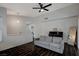 Bright living room features a black piano and dark wood-look floors at 705 Thousand Oaks Dr, Las Vegas, NV 89123