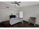 Bright living room with dark wood-look floors with a piano and grey sofa at 705 Thousand Oaks Dr, Las Vegas, NV 89123