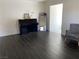 Living room with dark floors, piano, and access to sunroom at 705 Thousand Oaks Dr, Las Vegas, NV 89123