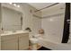 Clean bathroom with a shower-tub combo, modern vanity, and neutral color scheme at 7885 W Flamingo Rd # 1037, Las Vegas, NV 89147