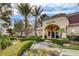 Clubhouse exterior with lush landscaping and a welcoming entrance at Rancho Viejo Condominiums at 7885 W Flamingo Rd # 1037, Las Vegas, NV 89147