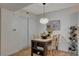 Charming dining area with a rustic table, stylish lighting, and a decorative wine rack at 7885 W Flamingo Rd # 1037, Las Vegas, NV 89147