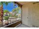 Cozy patio area with railing, landscaping, and an outdoor storage closet at Rancho Viejo Condominiums at 7885 W Flamingo Rd # 1037, Las Vegas, NV 89147