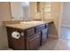 Bathroom with granite countertop, dark brown cabinets, and a modern sink at 8101 W Flamingo Rd # 2040, Las Vegas, NV 89147