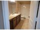 Bathroom with tub, shower, vanity, and tile flooring at 8101 W Flamingo Rd # 2040, Las Vegas, NV 89147