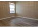 Bright bedroom featuring wood-look floors and window at 8101 W Flamingo Rd # 2040, Las Vegas, NV 89147